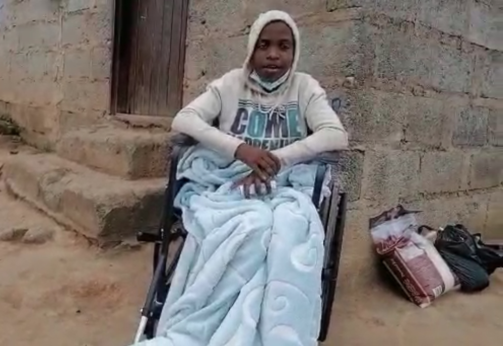 Disabled Andile Mamba(14) who was shot by Mswati’s police struggling to walk, appeals for assistance.