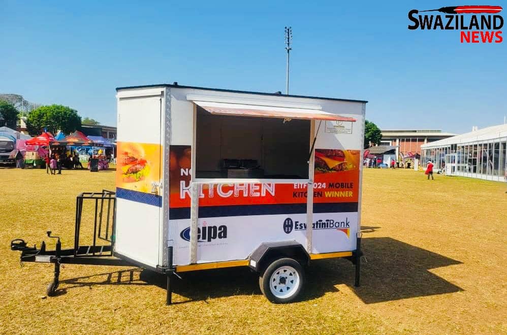 Eswatini Bank Managing Director Nozizwe Mulela hands over Mobile Kitchen worth R50,000.00 to winner Nconco at the International Trade Fair(EITF).
